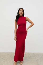 Woman wearing a red dress against a white background