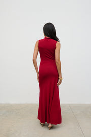 Woman wearing a red dress against a white background