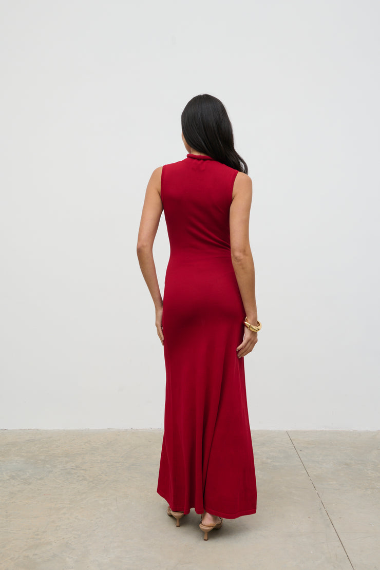 Woman wearing a red dress against a white background