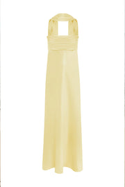 Long yellow dress with a pleated bodice on a white background